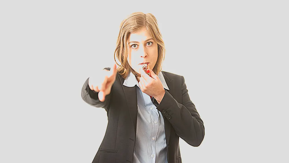 Woman points and blows whistle