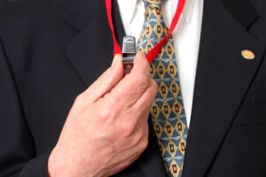 Man holds whistle