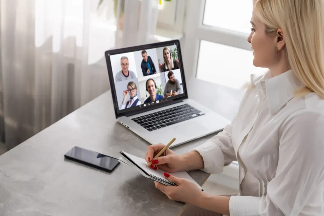 Woman attends an online meeting