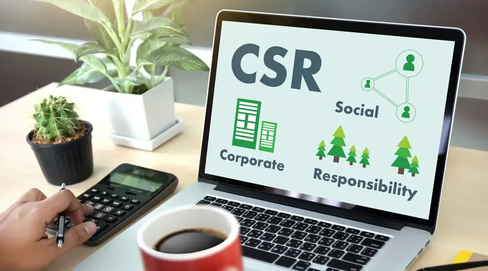 Laptop shows slide on corporate social responsibility