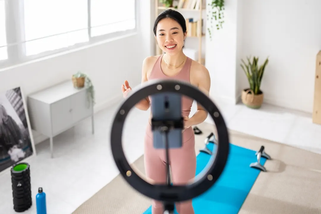 Social media influencer creates an exercise video