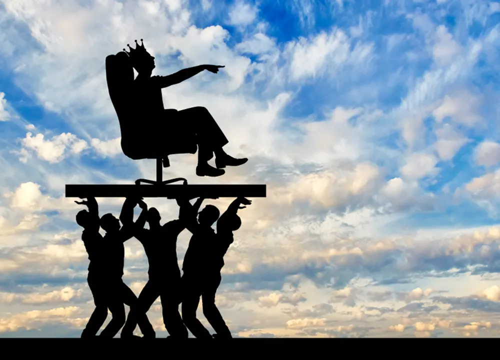 Employees carry king in office chair throne
