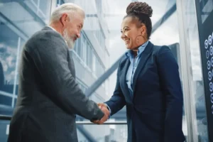Man and woman shake hands