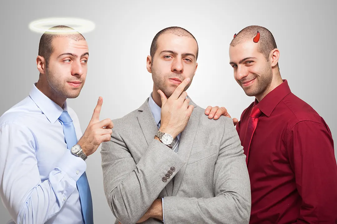 Angel on one side of man devil on the other