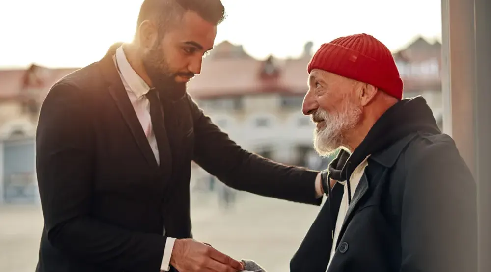 Homeless man handed money