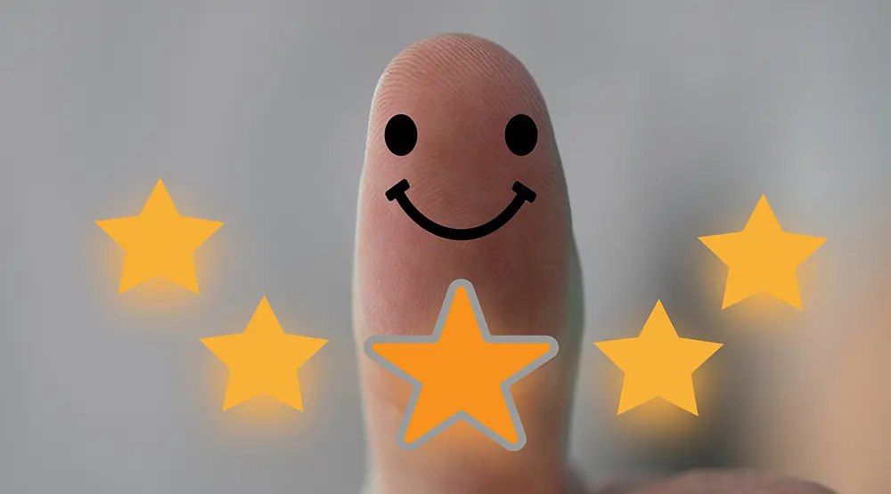 Smiley face on thumb, with five stars