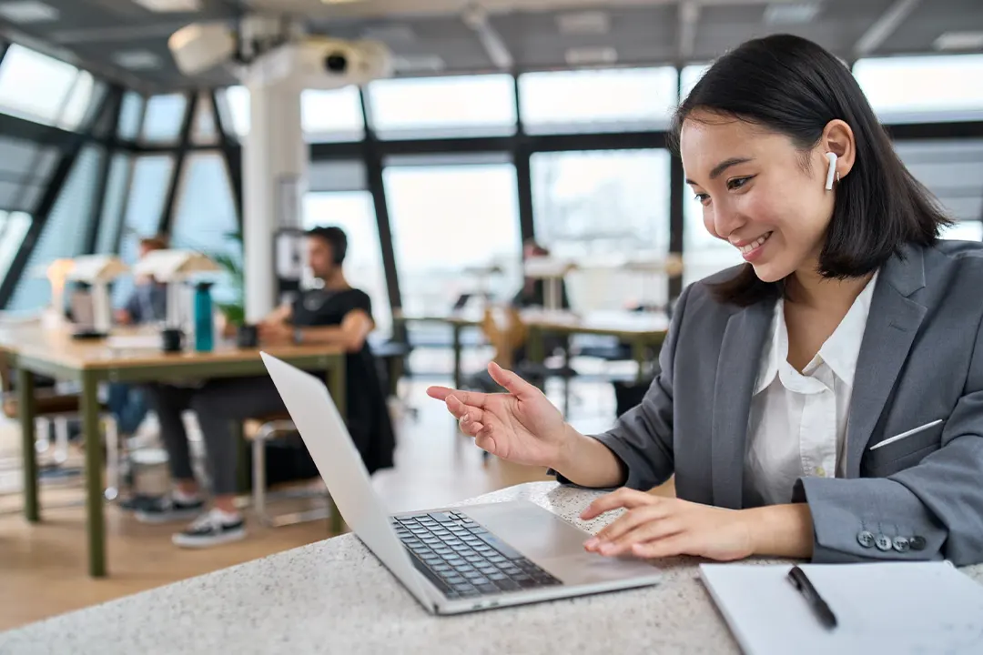 Businesswoman talks via laptop