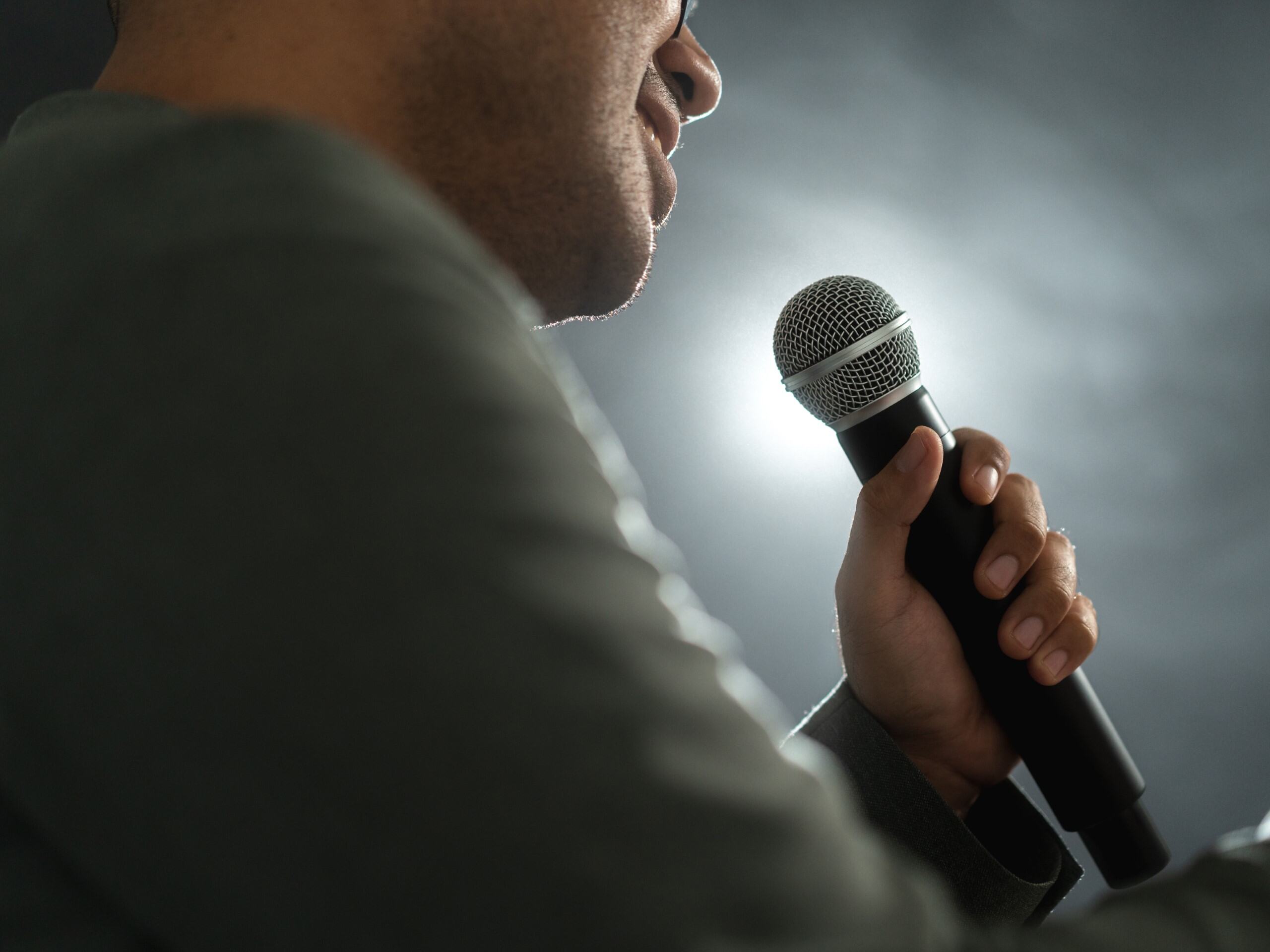 A man speaks into a microphone