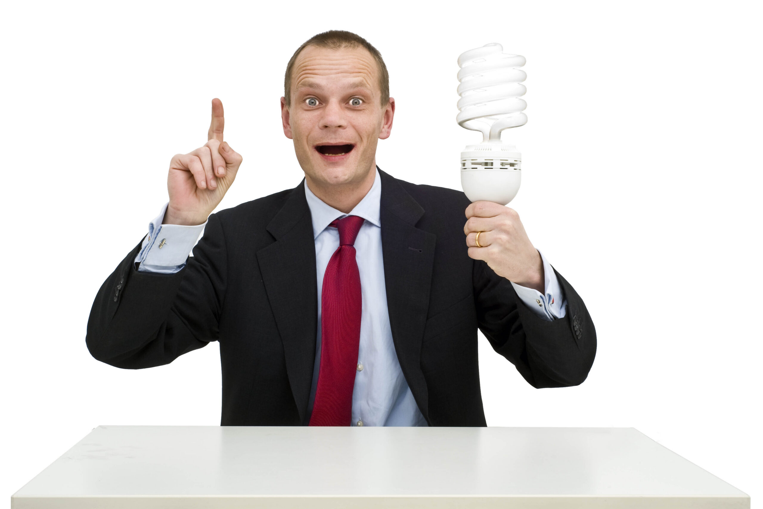 A businessman, smartly dressed in a suit, holding a lamp, illustrating the idea and innovation process. On the whiteboard behind him, a schematic innovation funnel is drawn;