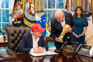 President Donald Trump, flanked by Vice President JD Vance and FIFA President Gianni Infantino, announces that the FIFA World Cup draw will take place on December 5 at the Kennedy Center, Friday, August 22, 2025 - USA (Official White House Photo by Joyce N. Boghosian)