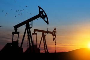 The change in oil prices caused by the war. Oil price cap concept. Oil drilling derricks at desert oilfield. Crude oil production from the ground. Petroleum production.;