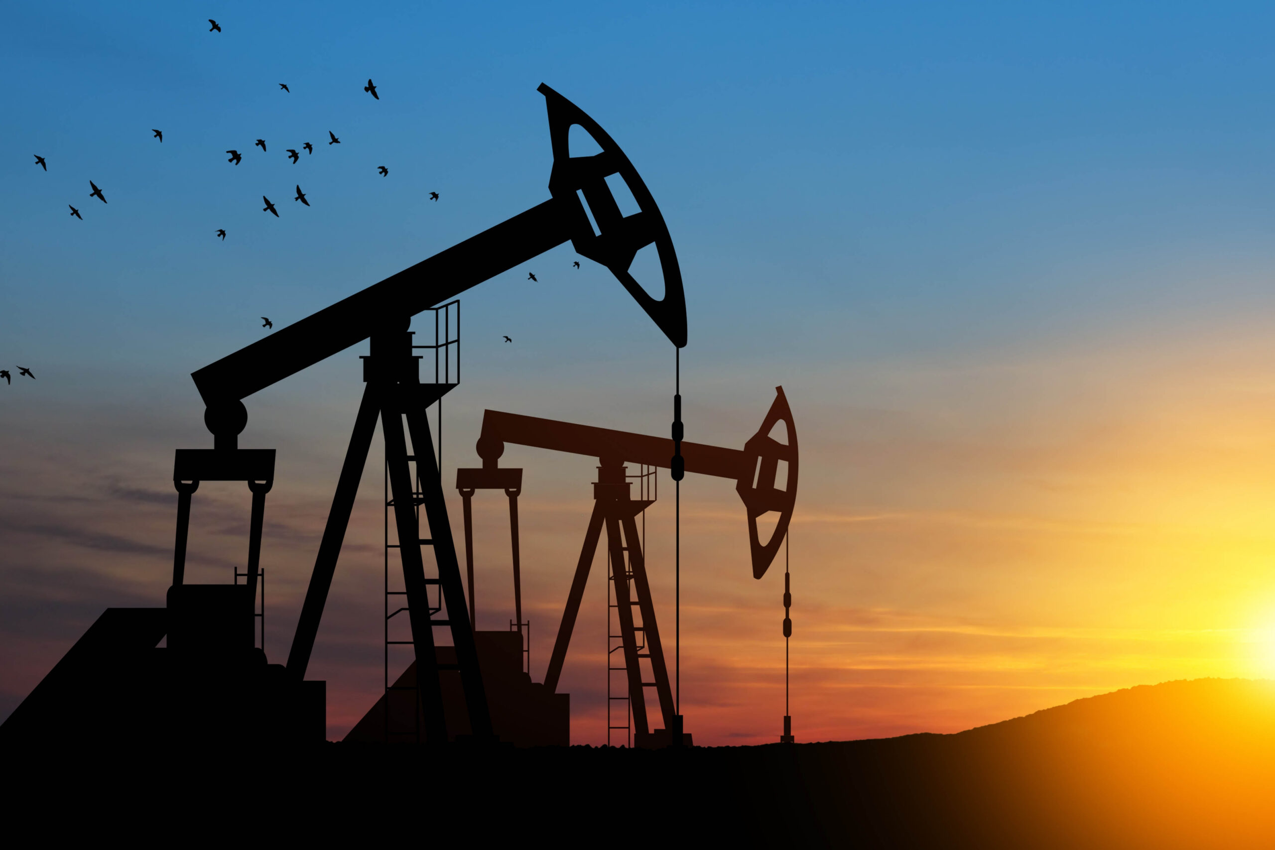 The change in oil prices caused by the war. Oil price cap concept. Oil drilling derricks at desert oilfield. Crude oil production from the ground. Petroleum production.;