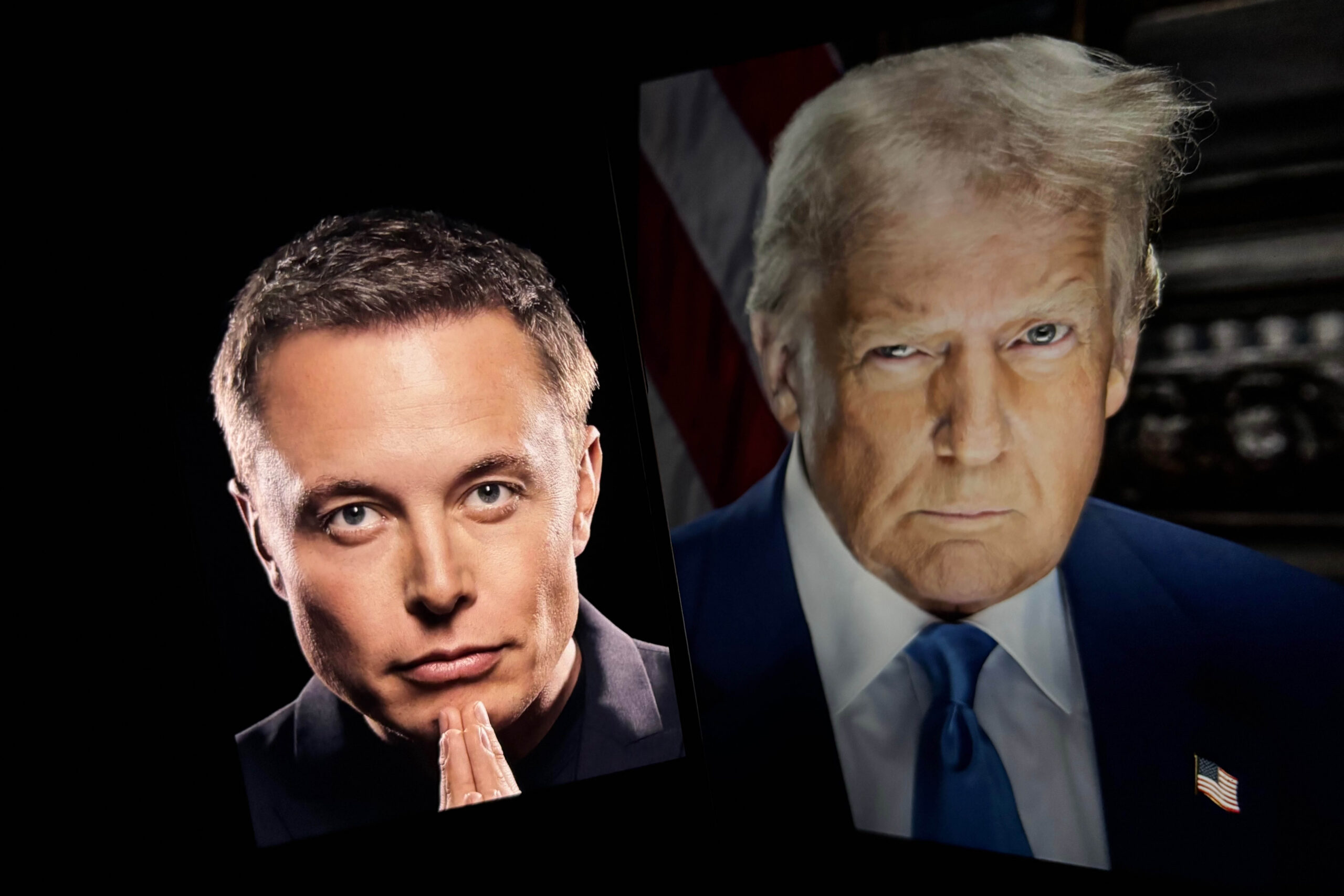 Toronto, Canada - May 14 2025 President-elect Donald Trump in the background with a picture of elon musk with his two hands together in front