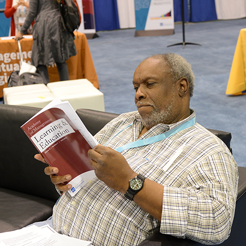 Access to research, man sitting reading a book