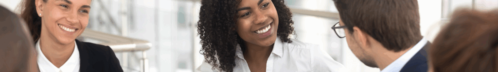 Image of people smiling in an interview setting