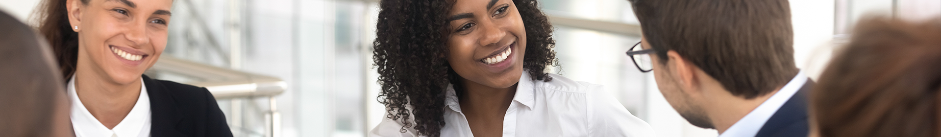 Image of people smiling in an interview setting